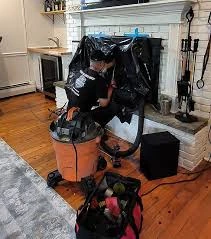 Fireplace cleaning equipment and protective coverings in a living room